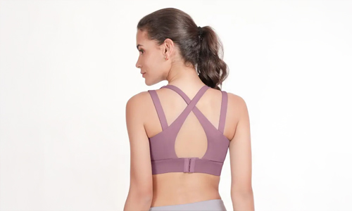 Woman wearing Stylish criss-cross sports bras for women, offering both support and fashion for an active lifestyle, available for online shopping at Shyaway.