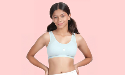 A young girl wearing a bra, showcasing a comfortable and stylish design with removable padding for teens.