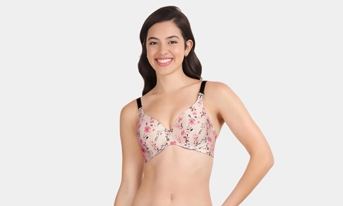 A woman models a chic colourful printed bra, exuding confidence and a playful sense of style.