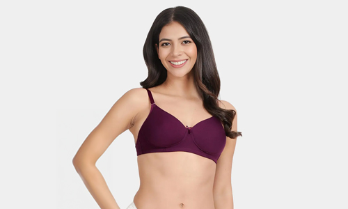 A woman models a dark purple transparent back padded bra top, showcasing its everyday comfort and style.