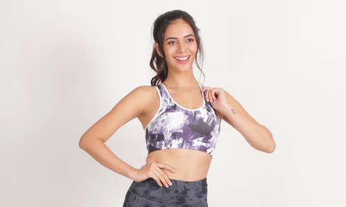 A stylish razorback sports bra featuring a bold print, perfect for workouts and active lifestyles.